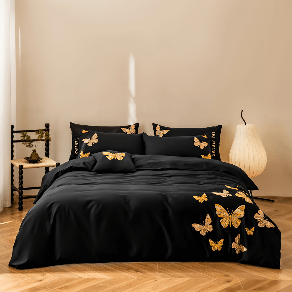 Black Butterfly Embroidered Egyptian Cotton Bedding Set featuring golden butterfly design on a black duvet and pillows.