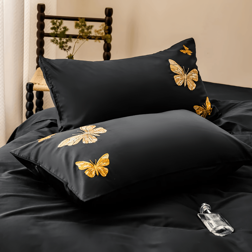 Black Butterfly Embroidered Egyptian Cotton Bedding Set featuring elegant pillows with golden butterfly design.