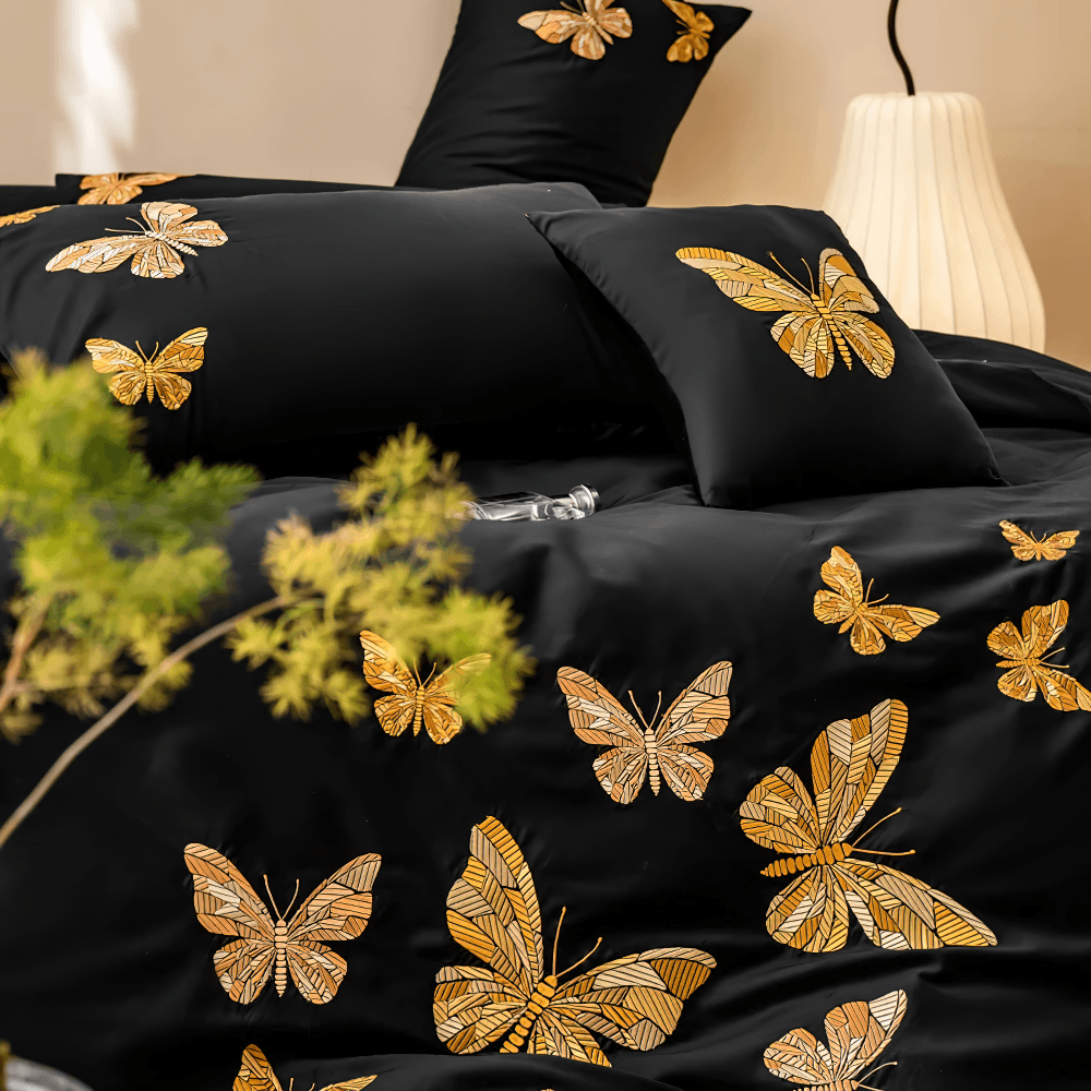 Black Butterfly Embroidered Egyptian Cotton Bedding Set with golden butterfly design on a luxurious black duvet cover.