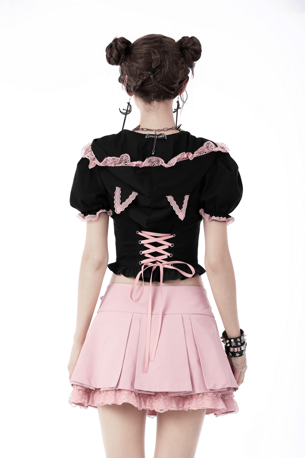 Back view of a Black Cat Ear Crop Top with pink lace detailing, paired with a cute pink skirt.