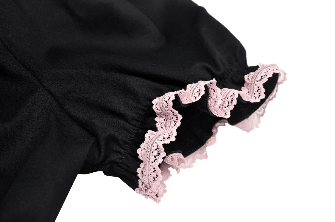 Black crop top detailing featuring a playful pink lace collar, perfect for a cute cat-inspired outfit.