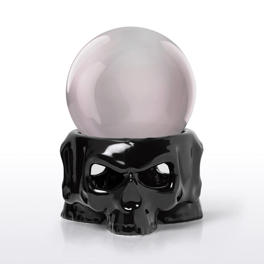 Black ceramic skull mug warmer with crystal ball on top, perfect for gothic decor and scrying sessions.