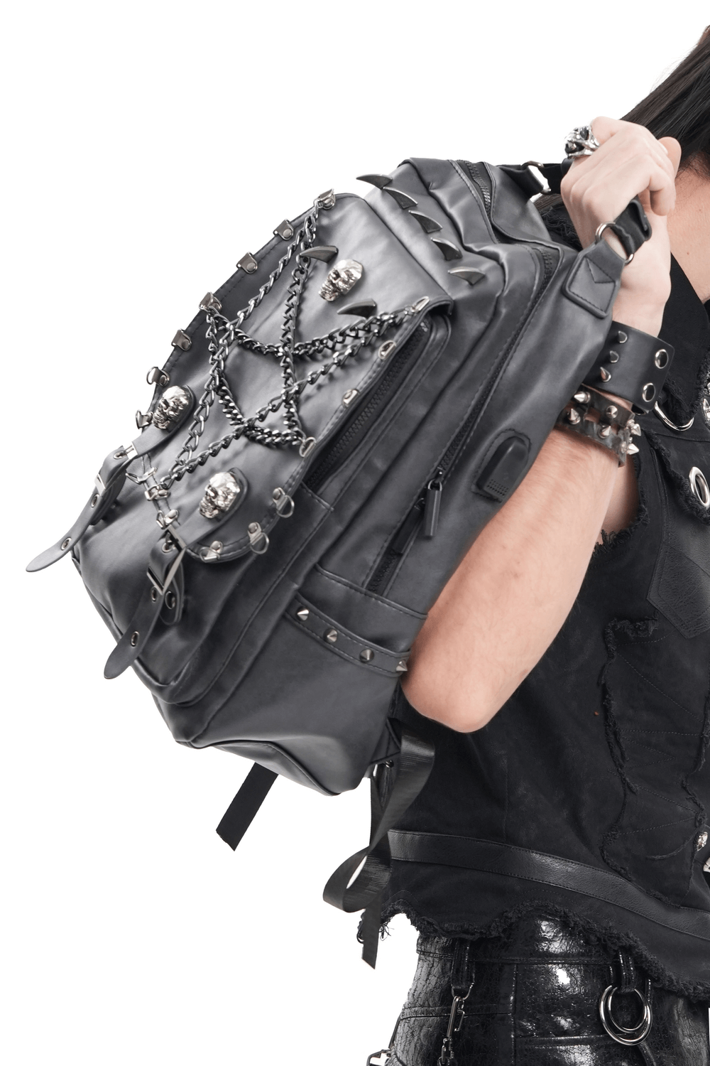 Edgy black gothic backpack with skull and chain embellishments, showcasing spikes and multiple compartments for style and function.