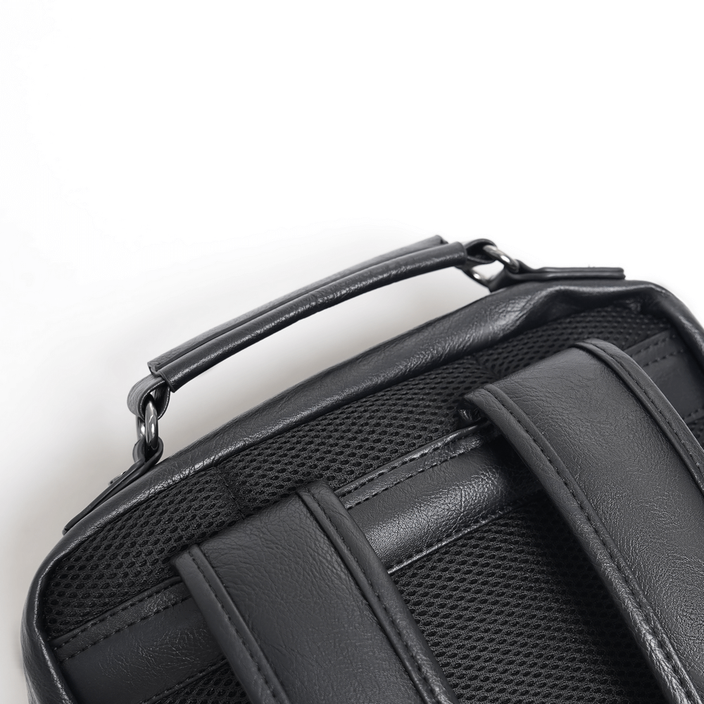 close-up of black gothic backpack handle and straps showcasing durable design and sleek aesthetics