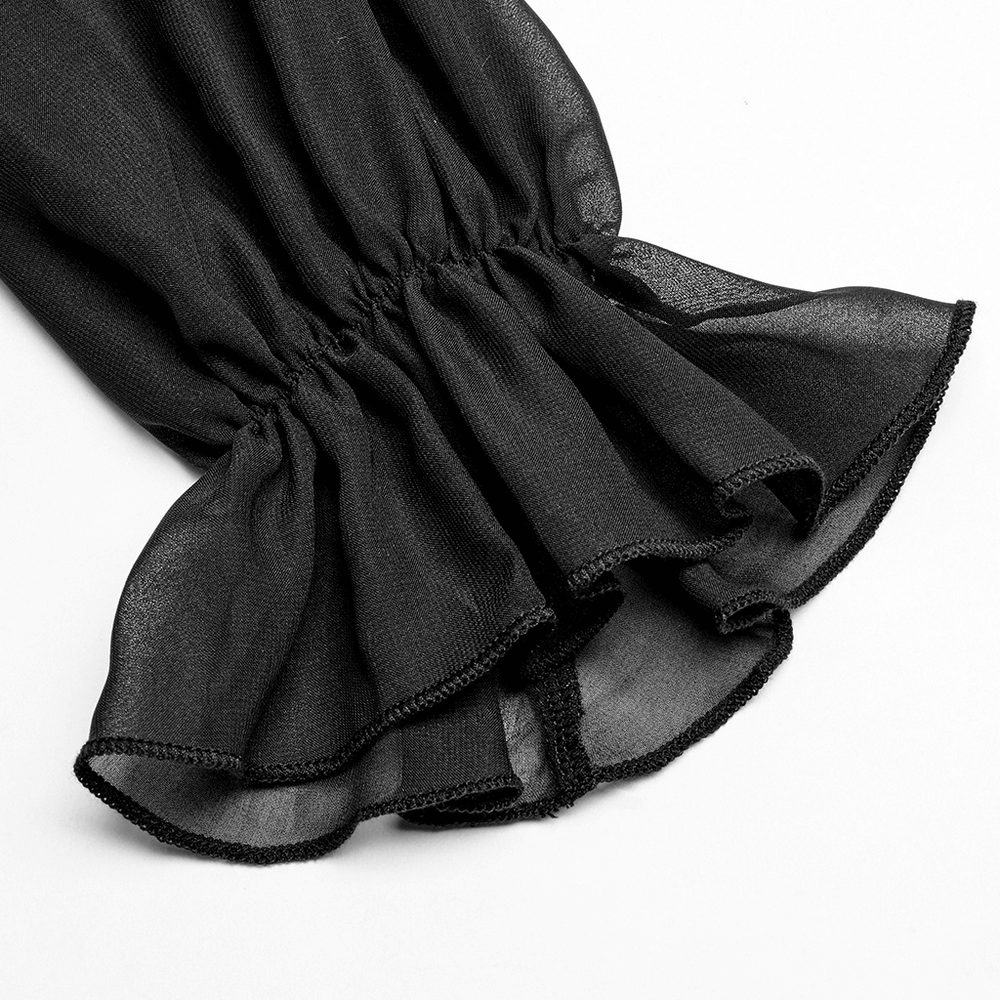 Close-up of the ruffled sleeve detail on a black chiffon dress, showcasing its delicate, sheer fabric and elegant finish.