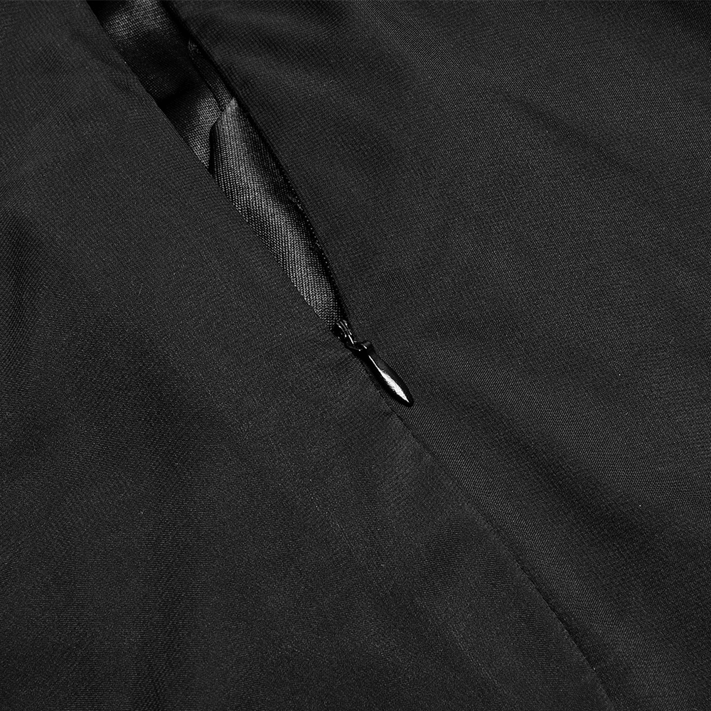 Close-up of the zipper detail on a sleek black dress, showcasing quality craftsmanship and elegant design.