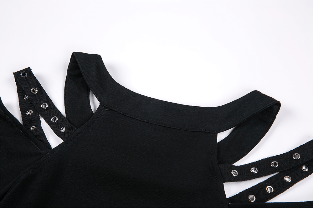 Close-up of black cold shoulder top with studded straps, showcasing an edgy punk design and minimalist aesthetic.