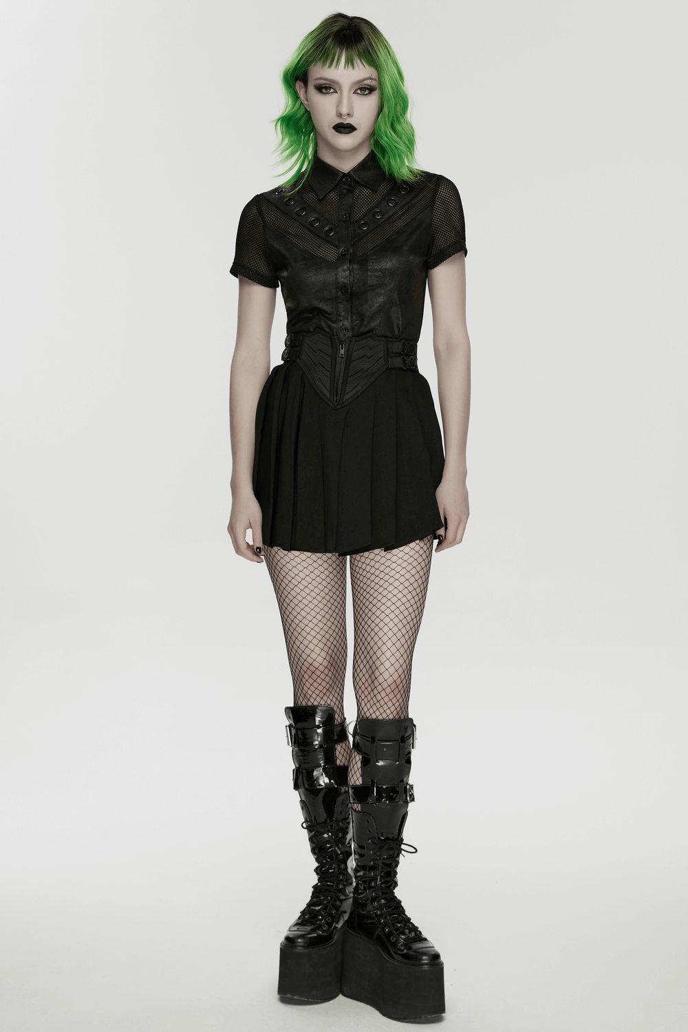 Black Cyberpunk Buckle Waist Pleated Mini Skirt styled with a leather top and platform boots, perfect for edgy streetwear.