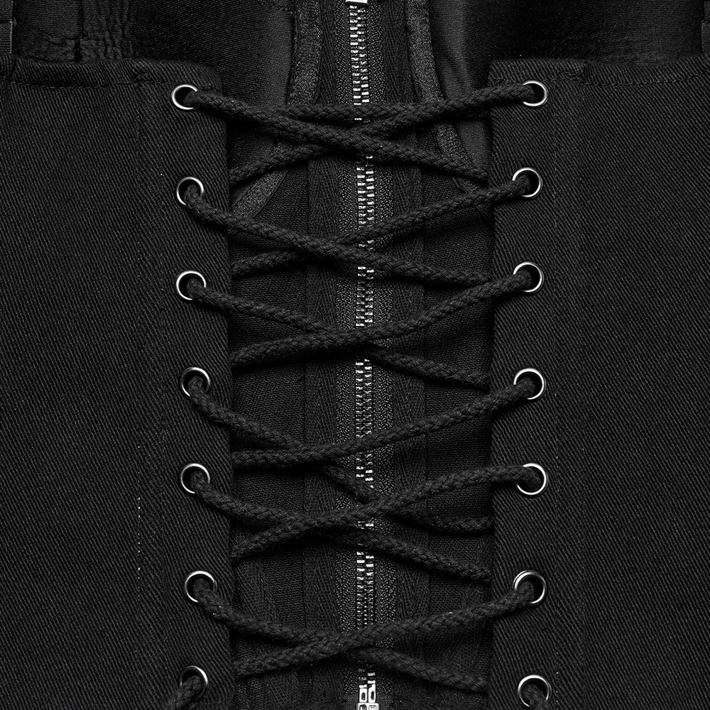 Close-up of the lacing and zipper detail on a black cyberpunk corset waistcoat with buckle straps.