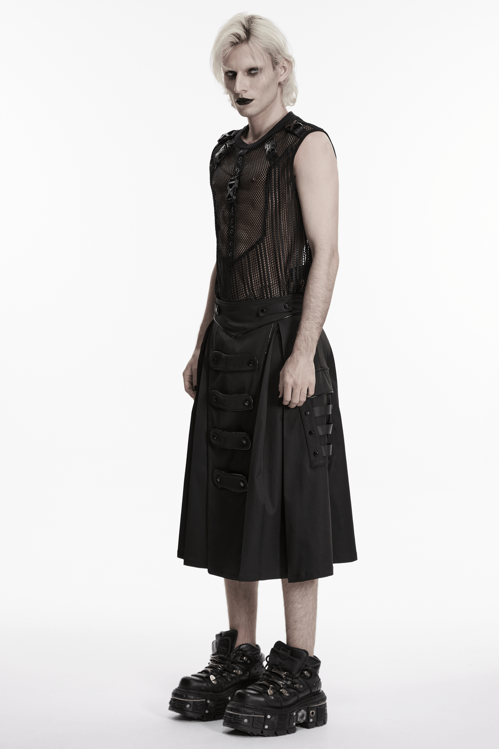 Black Cyberpunk Utility Skirt with Strap Panels for Men worn by model, showcasing draped twill and industrial details.