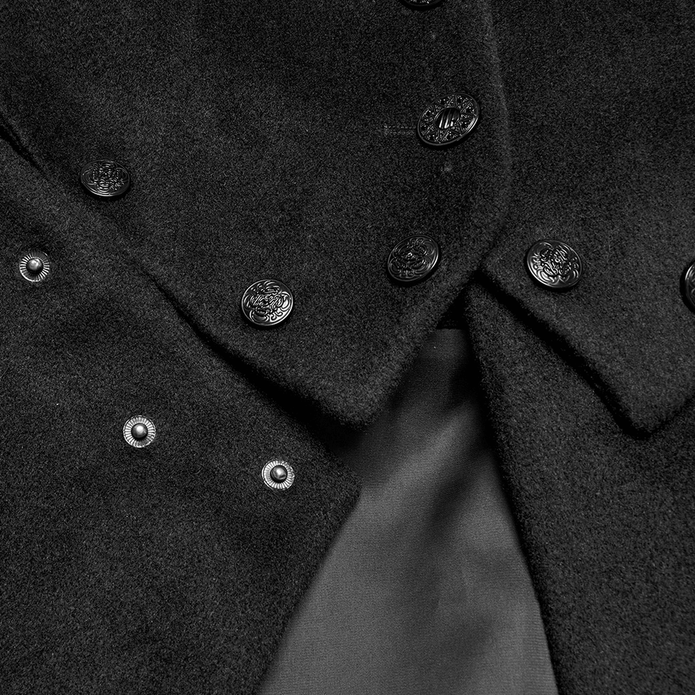 Close-up of black detachable coat buttons showcasing intricate vintage designs.
