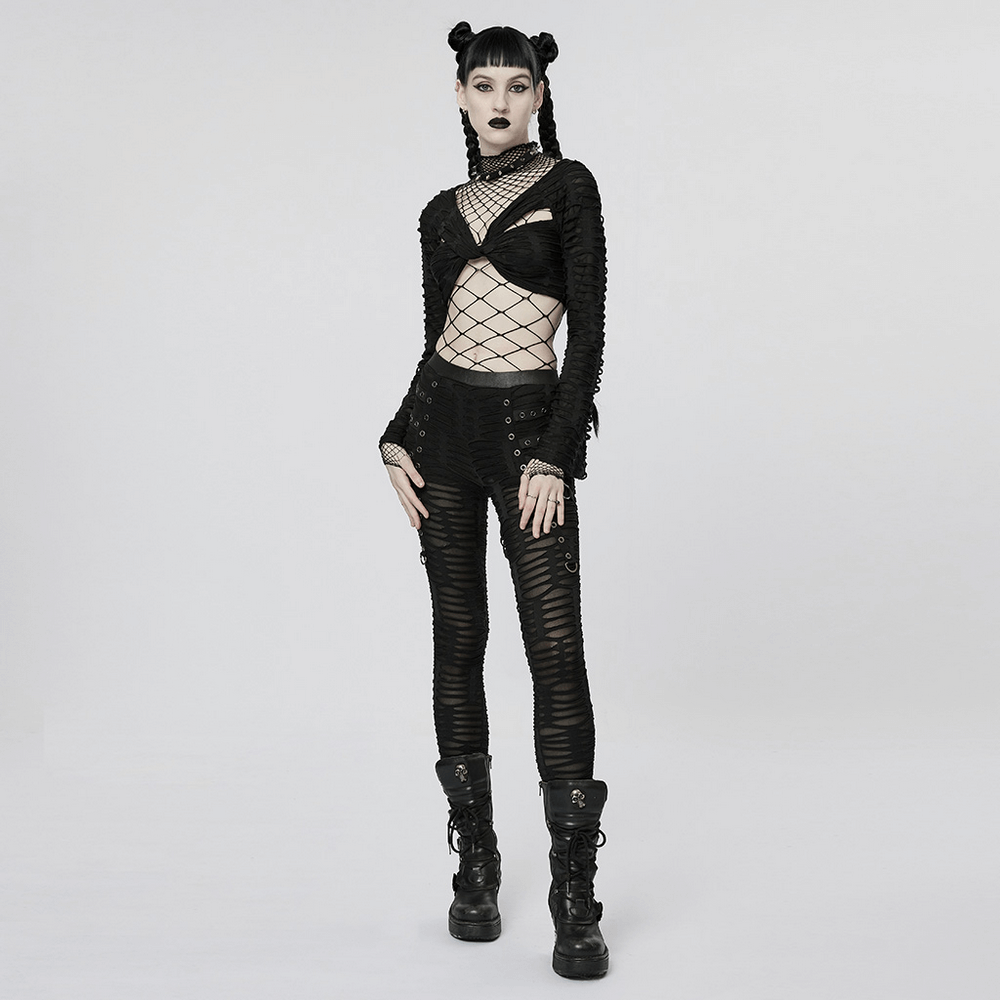 Edgy model in a black diamond mesh bodysuit and distressed pants, exuding punk style and bold fashion.