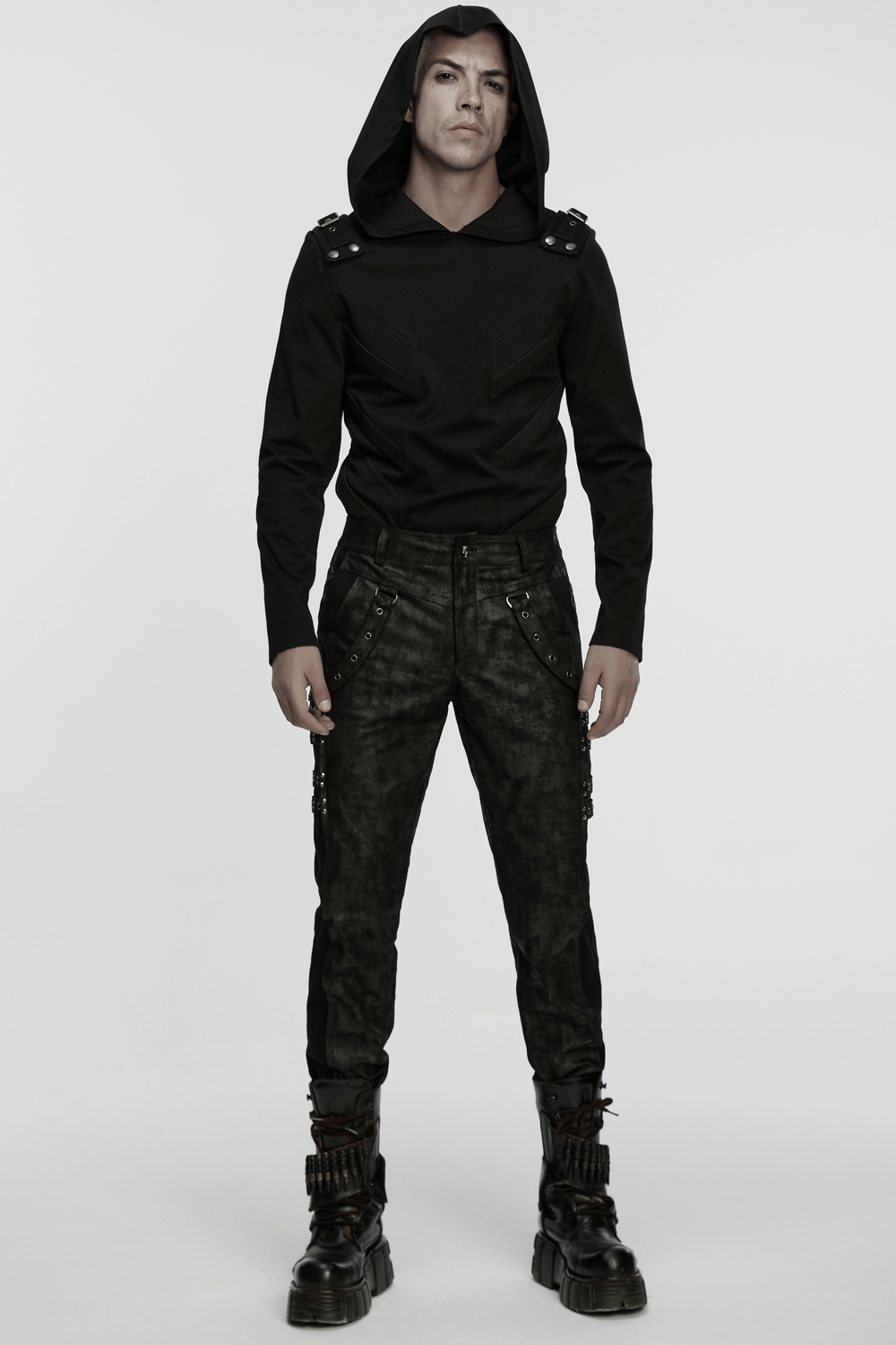 Black Distressed Twill Pants with Metal Eyelet Straps showcased with a sleek fitted top and stylish boots.