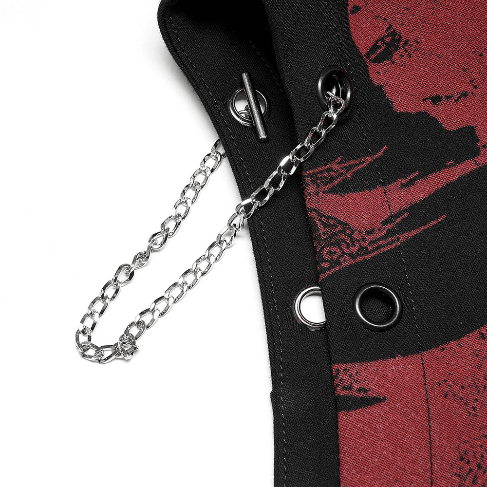 Close-up of black asymmetrical skirt detail featuring red dragon print, side eyelets, and detachable chain.