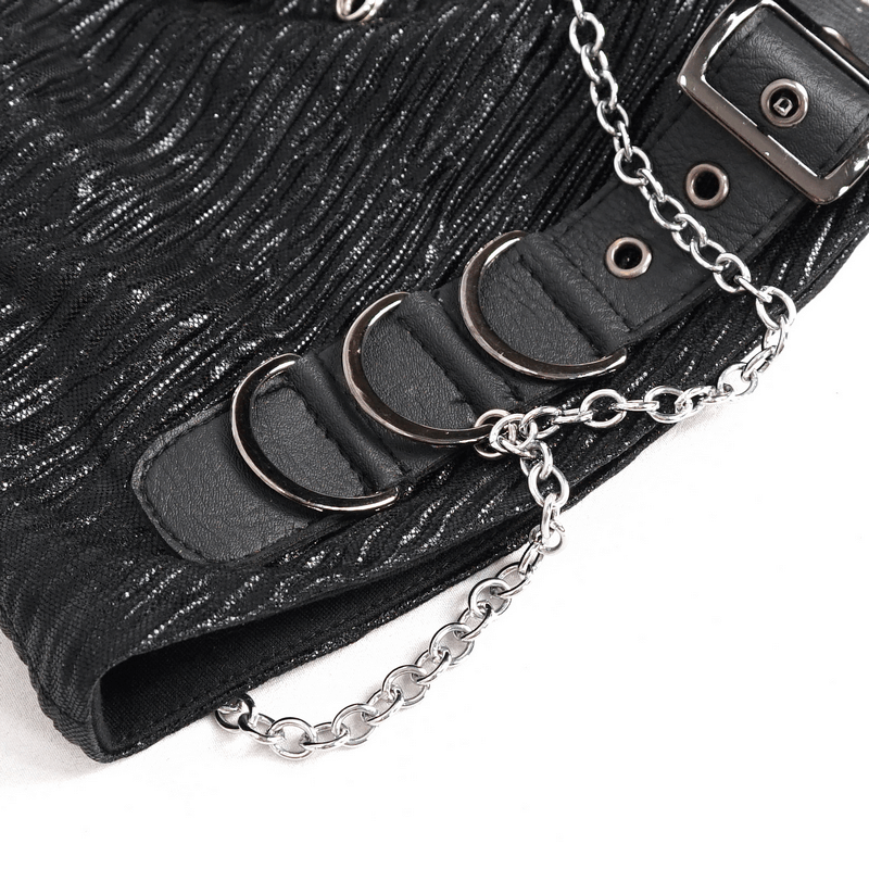 Close-up of black batwing buckle hat showcasing chains and buckles in edgy gothic style.
