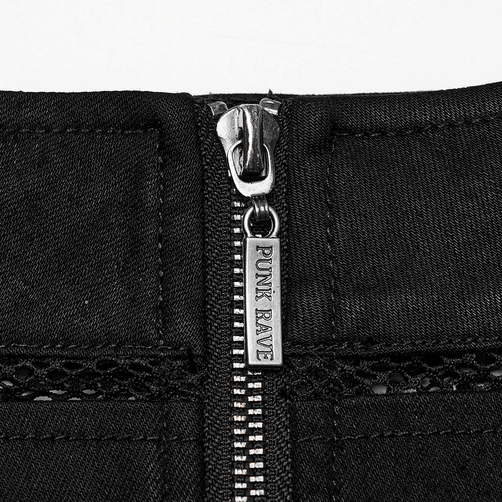 Close-up of the zipper detail on a black denim mini skirt with edgy mesh panels, showcasing the punk rock style.