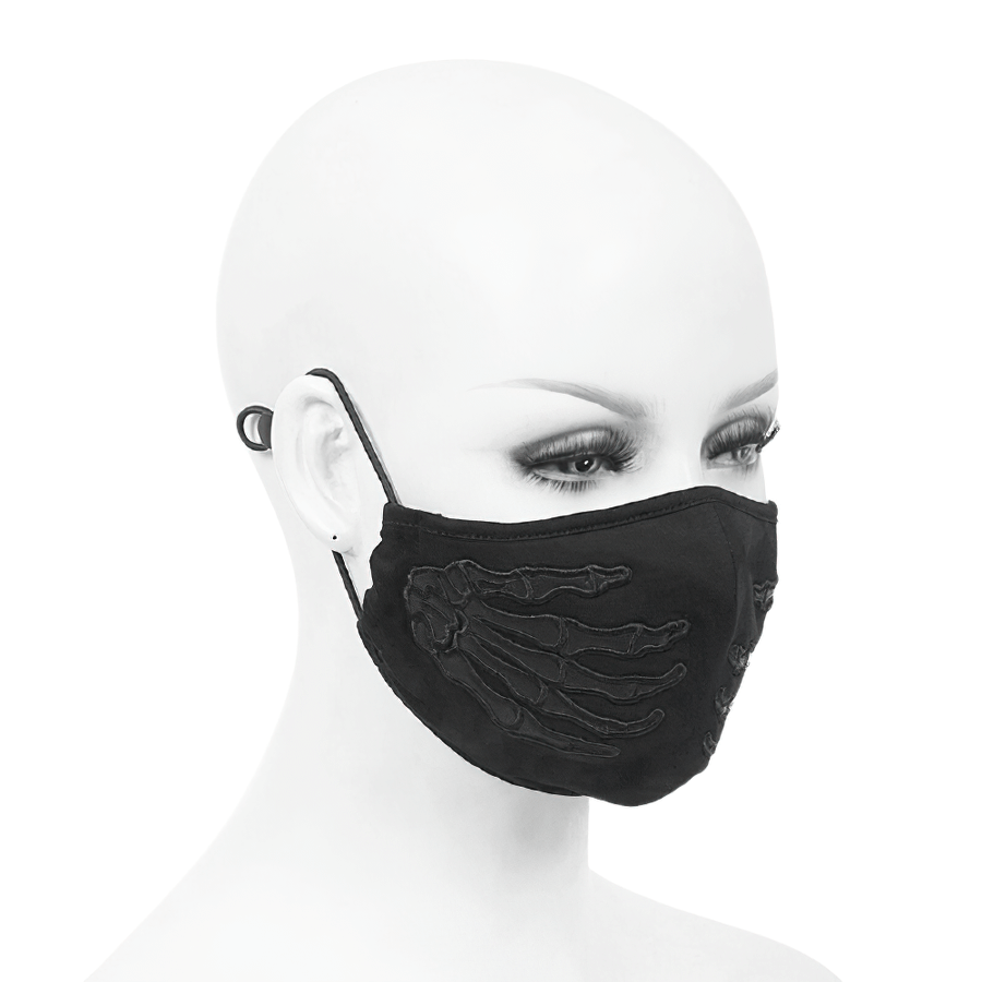 Gothic black skeleton face mask on mannequin showcasing stylish skeleton hands design and adjustable straps.