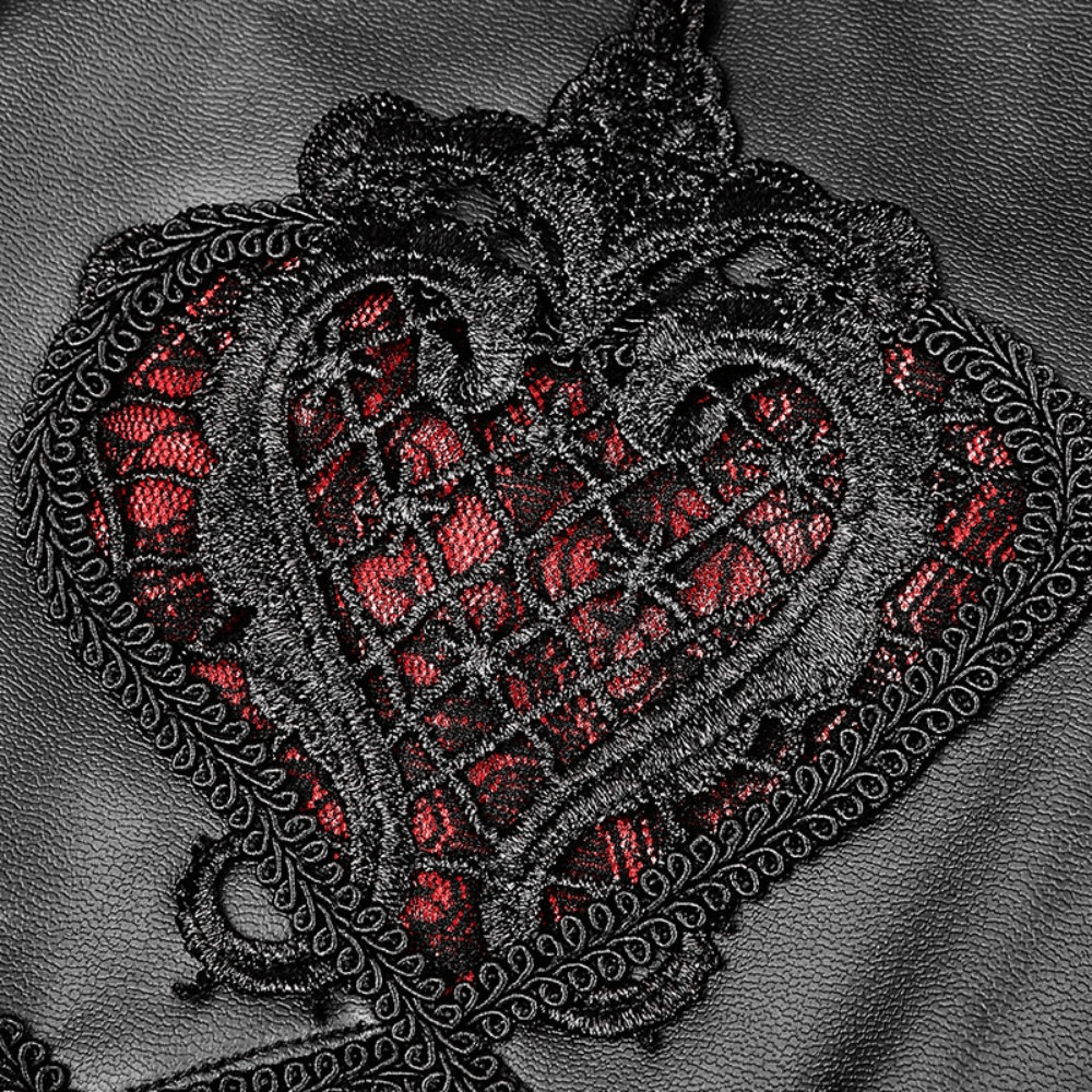 Black faux leather close-up featuring intricate red floral lace heart design, showcasing gothic elegance.