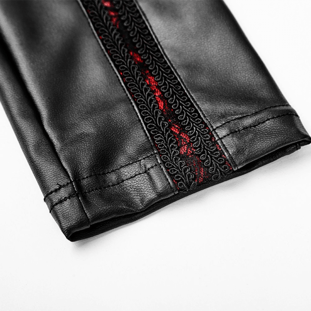 Close-up of black faux leather leggings featuring red floral lace detail, perfect for a gothic-inspired look.