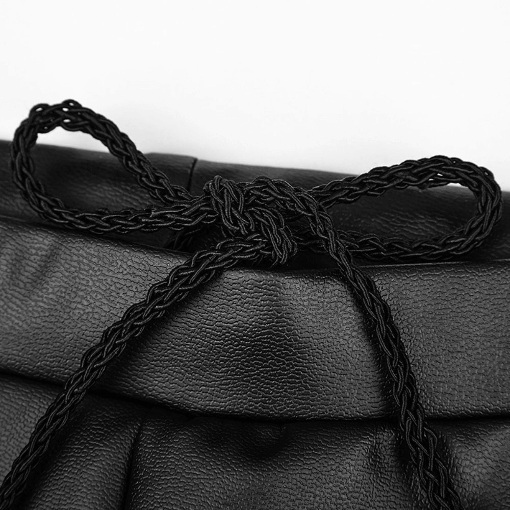 Close-up of a braided black faux leather drawstring detail showcasing gothic elegance.
