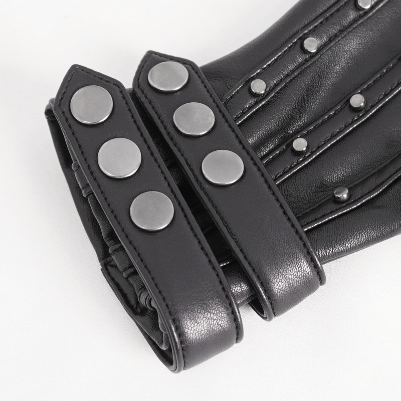 Close-up of black faux leather motorcycle gloves with metallic protective studs and stylish straps.
