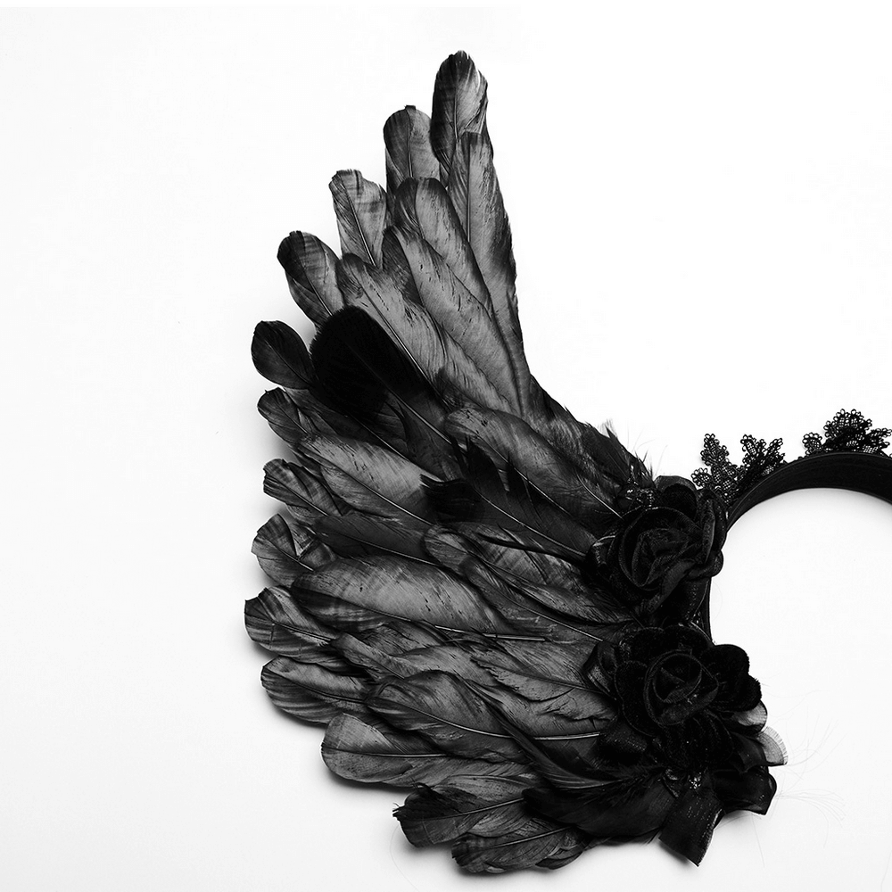 Black feather angel wings headband with delicate flowers and lace for a gothic, elegant look.