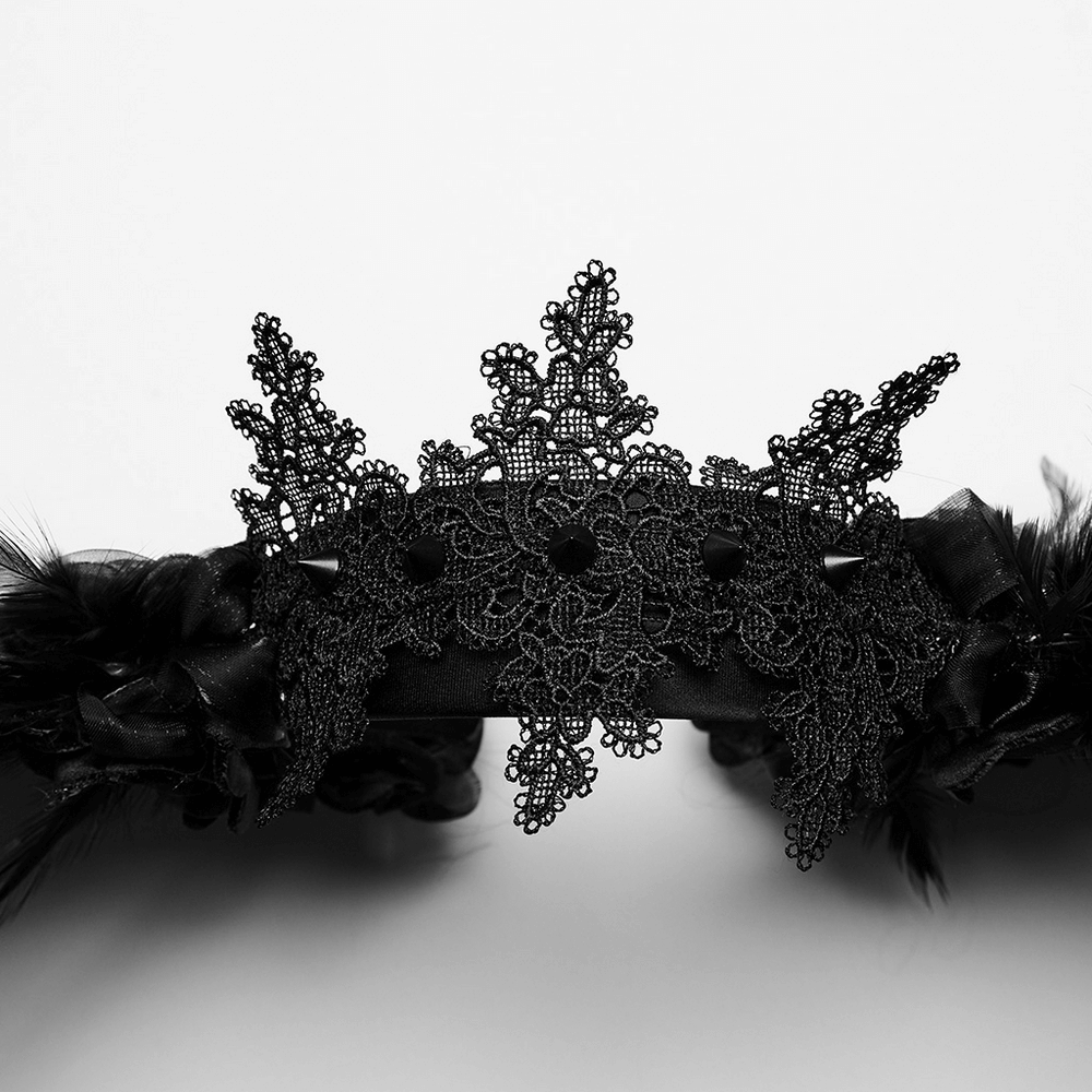Black feather angel wings headband with lace detailing and feminine floral accents for a gothic look.