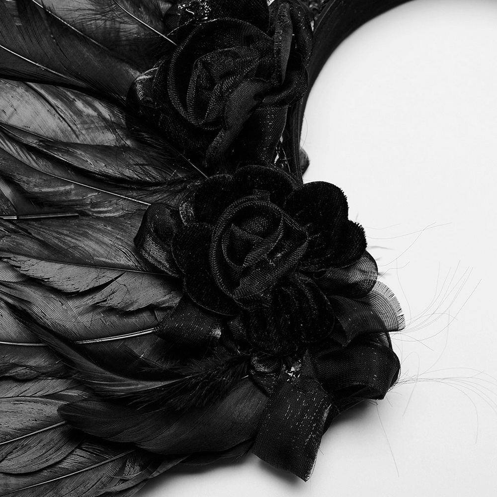 Gothic black feather angel wings headband with elegant black fabric flowers, perfect for a dark angel look.