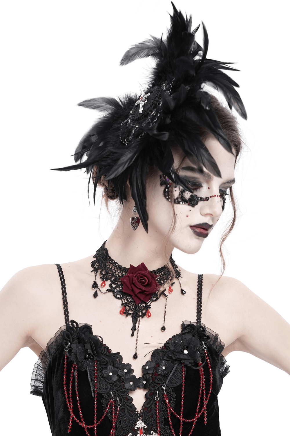 Gothic model wearing a dramatic black feather brooch and hair clip with lace and cross detail, styled for Victorian flair.