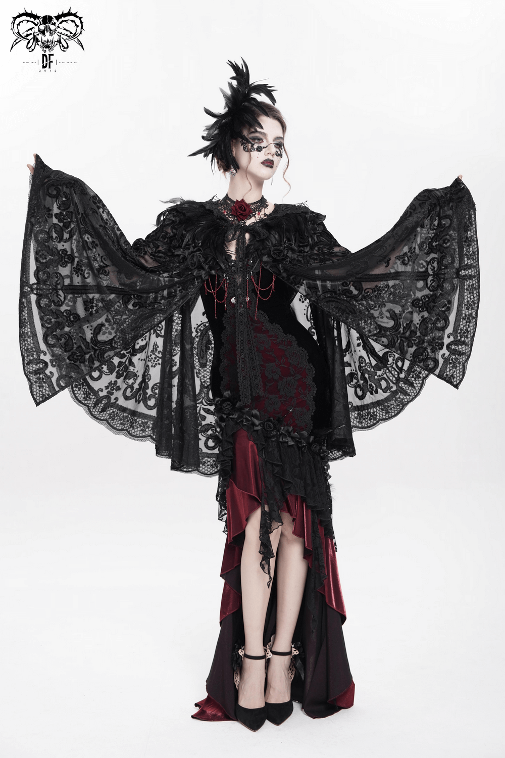 Victorian goth model in dramatic black lace cape and dress, showcasing elegant gothic fashion and style.