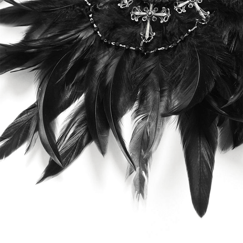 Close-up of black feathers with intricate lace and cross detail for a gothic brooch and hair accessory.