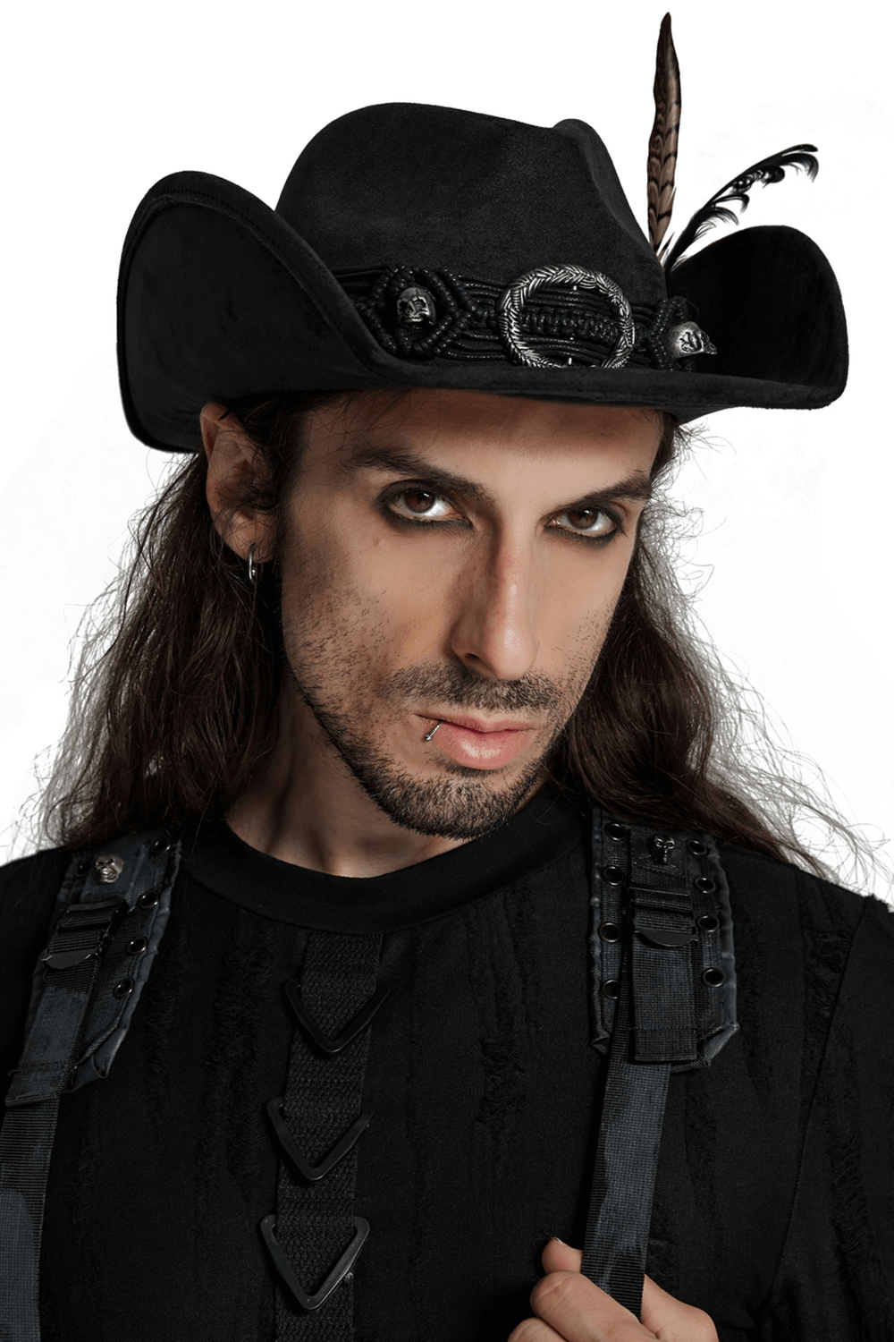 Gothic cowboy hat with black feathers and braided band on a model, showcasing dark and stylish Western flair.