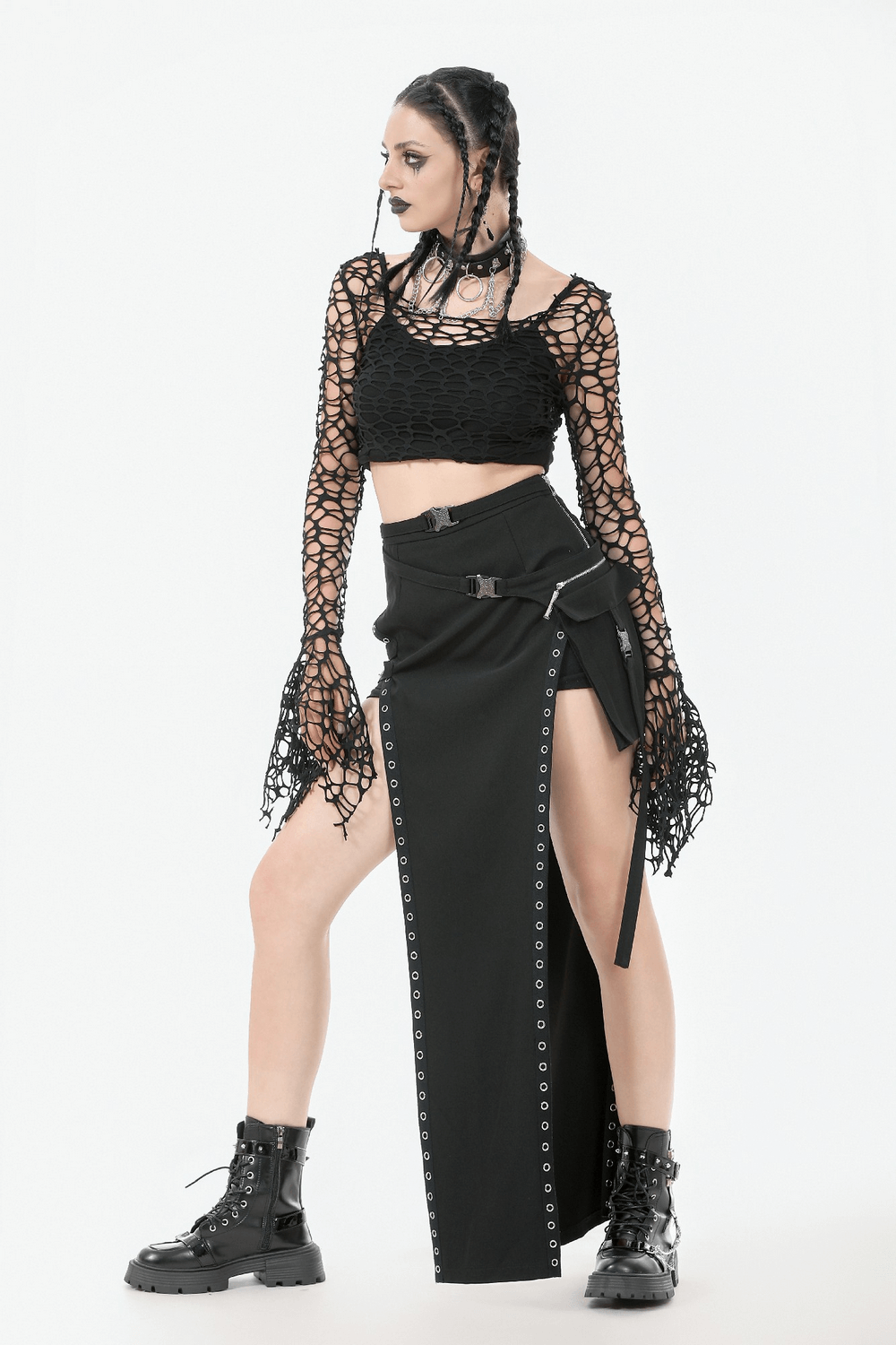 Black Fishnet Mesh Off-Shoulder Gothic Crop Top styled with a black skirt and combat boots for a striking gothic look.