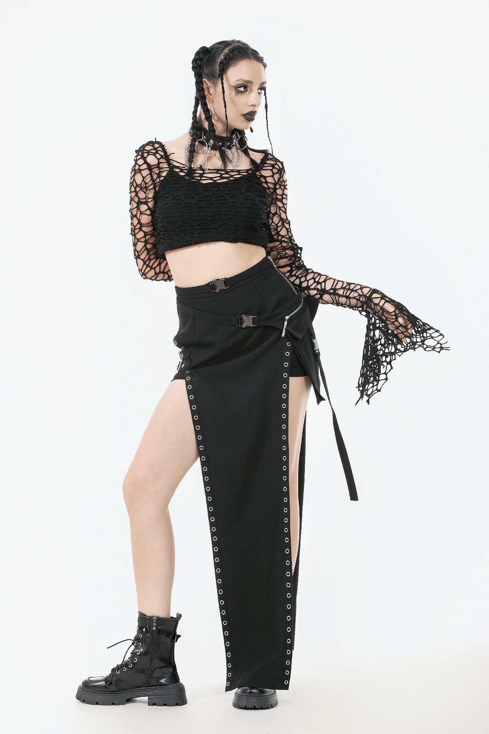 Black Fishnet Mesh Off-Shoulder Gothic Crop Top worn with a dramatic black skirt and edgy boots, showcasing a gothic fashion look.