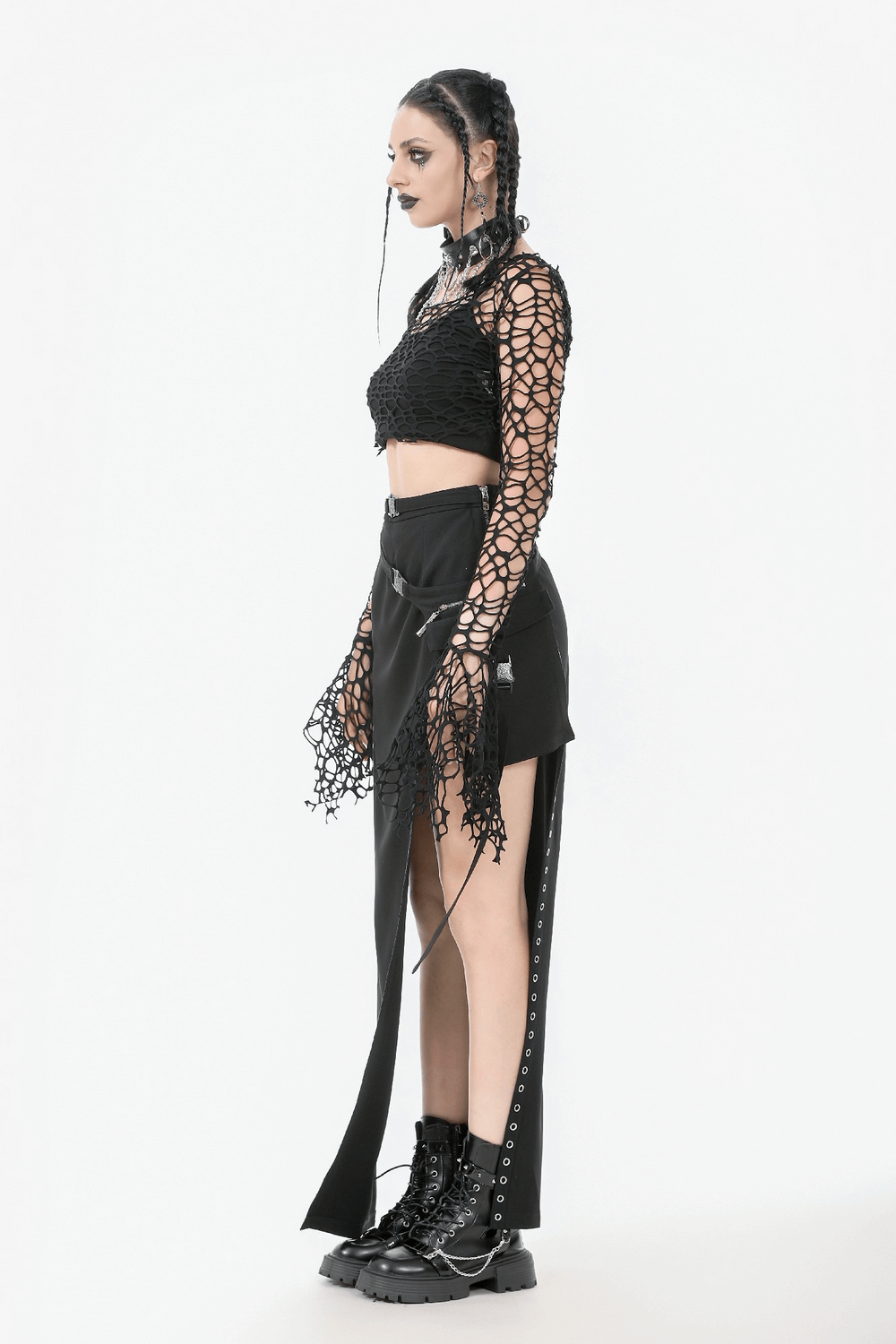 Black Fishnet Mesh Off-Shoulder Gothic Crop Top on a model paired with edgy bottoms and combat boots.
