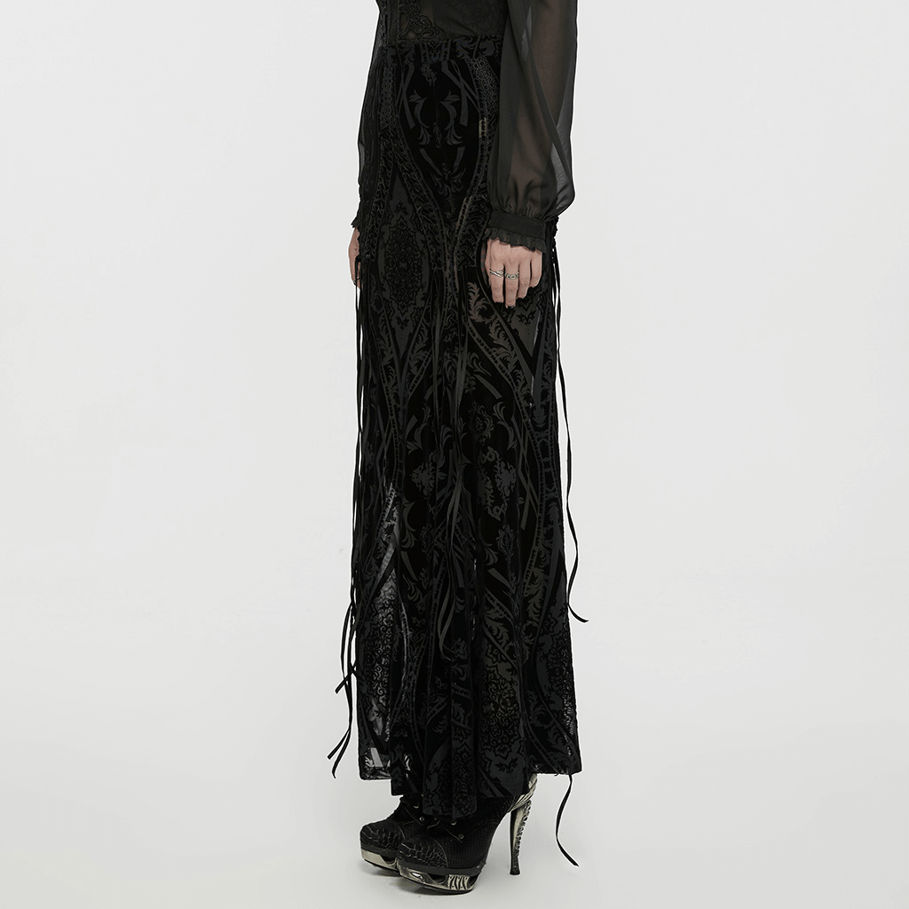 Black flocked mesh gothic maxi skirt with lace details, showcasing flowing design and intricate patterns.
