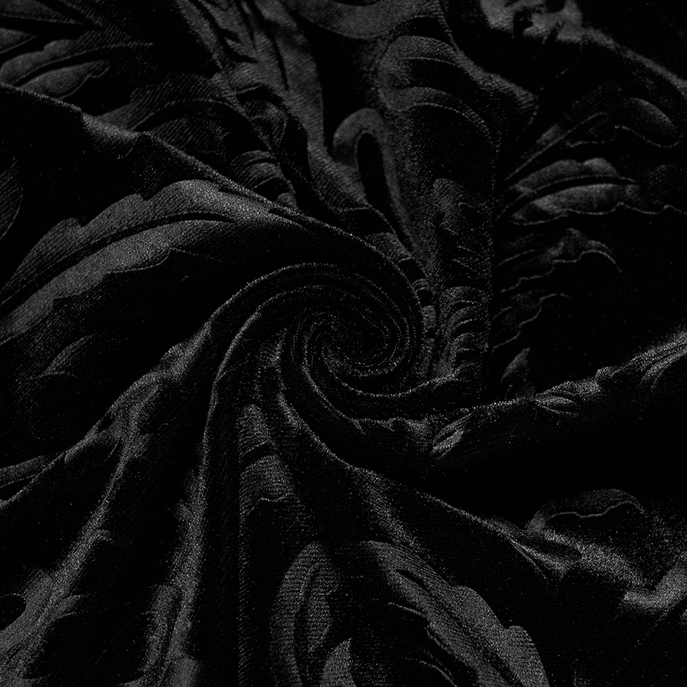 Close-up of luxurious black floral velvet fabric, ideal for gothic fashion and stylish designs.