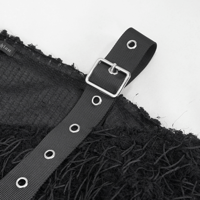 Close-up of off-shoulder black fluffy sweater strap with metal buckle, showcasing punk fashion style.