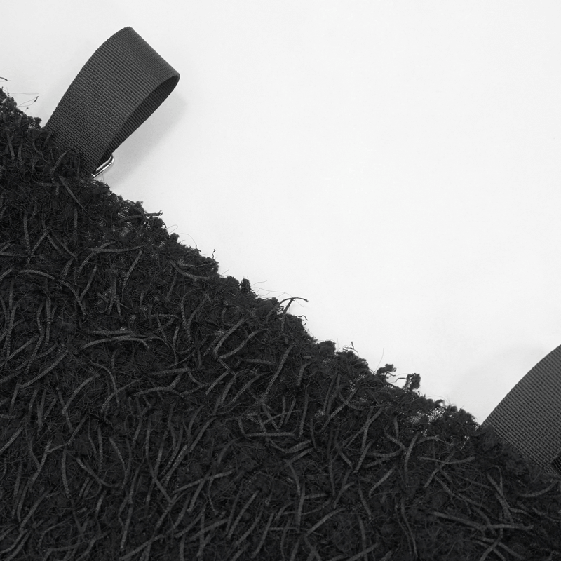 Close-up of the black fluffy off-shoulder sweater showing its edgy texture and stylish straps.