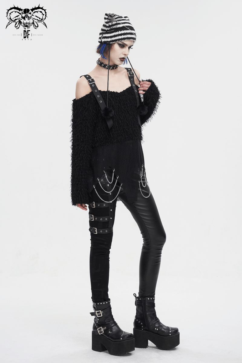 Edgy women’s black fluffy off-shoulder sweater styled with punk accessories and leather leggings for a rebellious look.