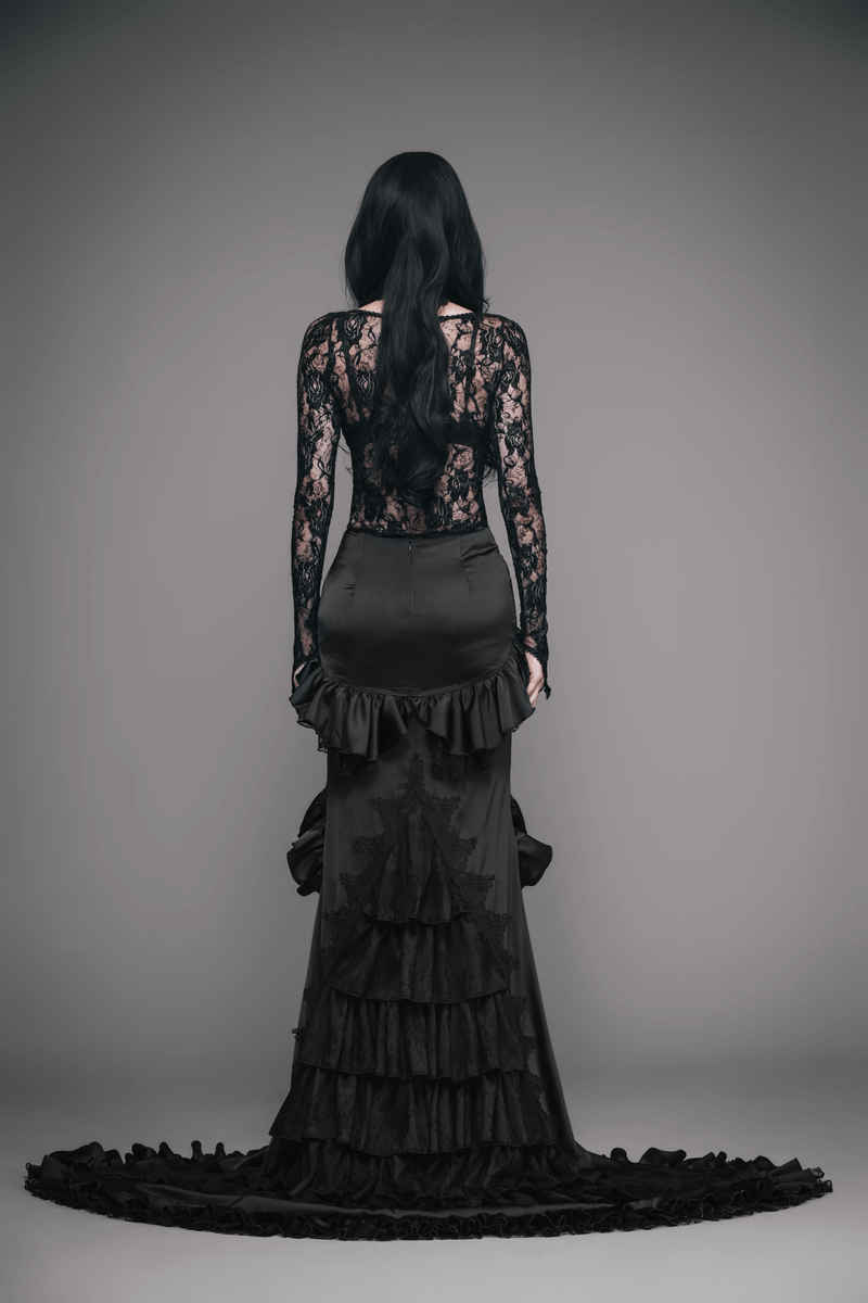 Back view of a gothic elegant black frilled skirt with long train, paired with a lace top, showcasing a stylish design.