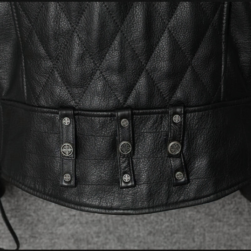 Close-up of black genuine leather biker jacket featuring quilted pattern and stylish button details.