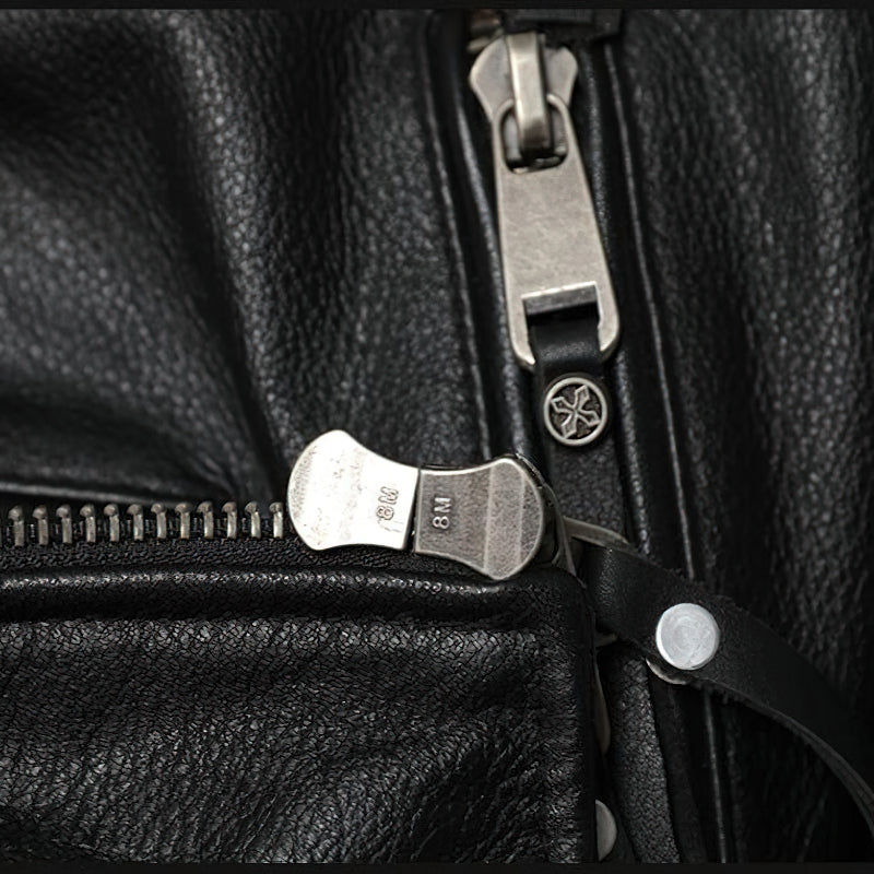 Close-up of zipper detail on a black genuine leather biker jacket, showcasing quality craftsmanship and design.
