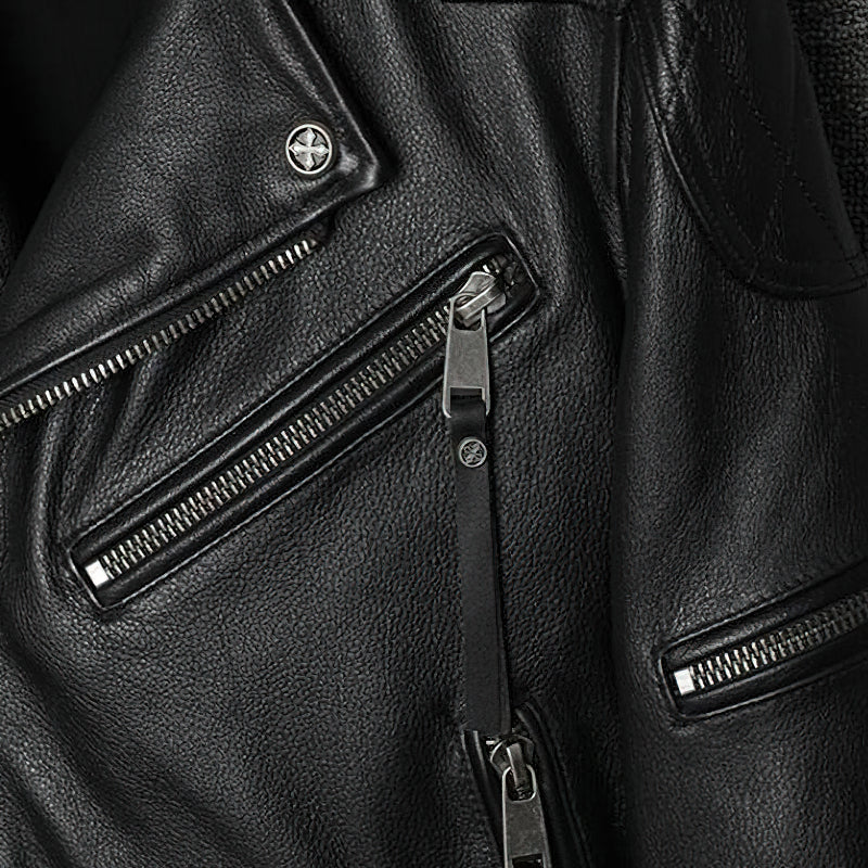 Close-up of black genuine leather biker jacket showcasing zippers and stylish detailing.