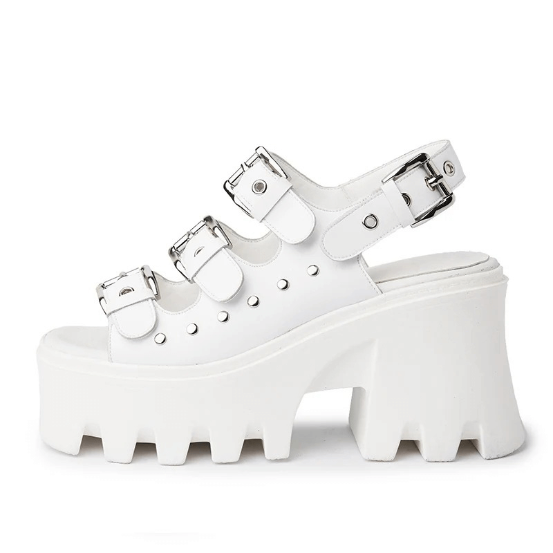 Stylish white platform sandals with buckles and rivets, perfect for a chic summer punk look.