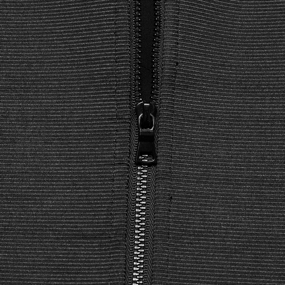 Close-up of the zipper detail on a stylish black goth corset cami with adjustable straps.