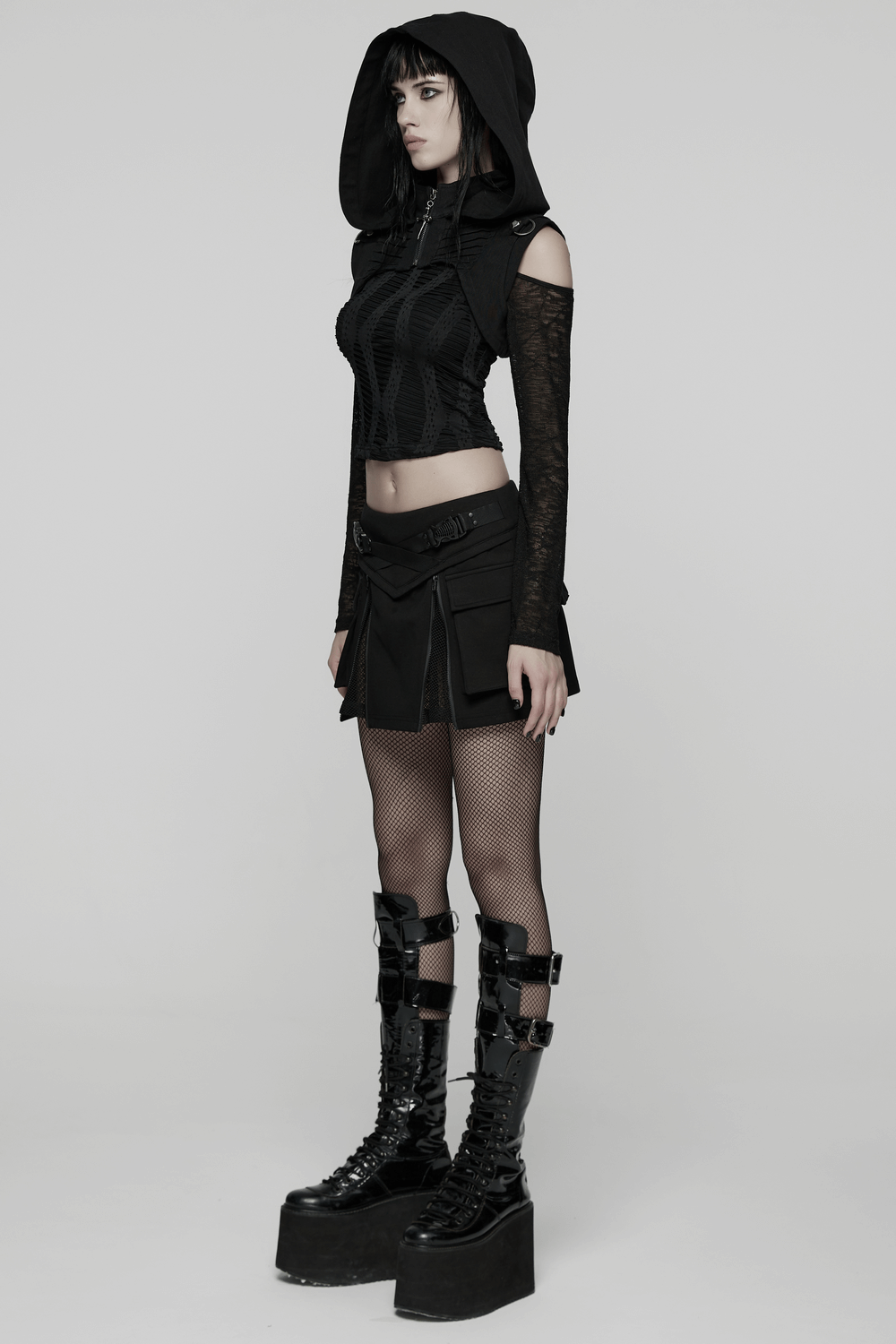 Model wearing a Black Goth Hooded Capelet with Zipper and Stud Details, showcasing edgy gothic fashion.