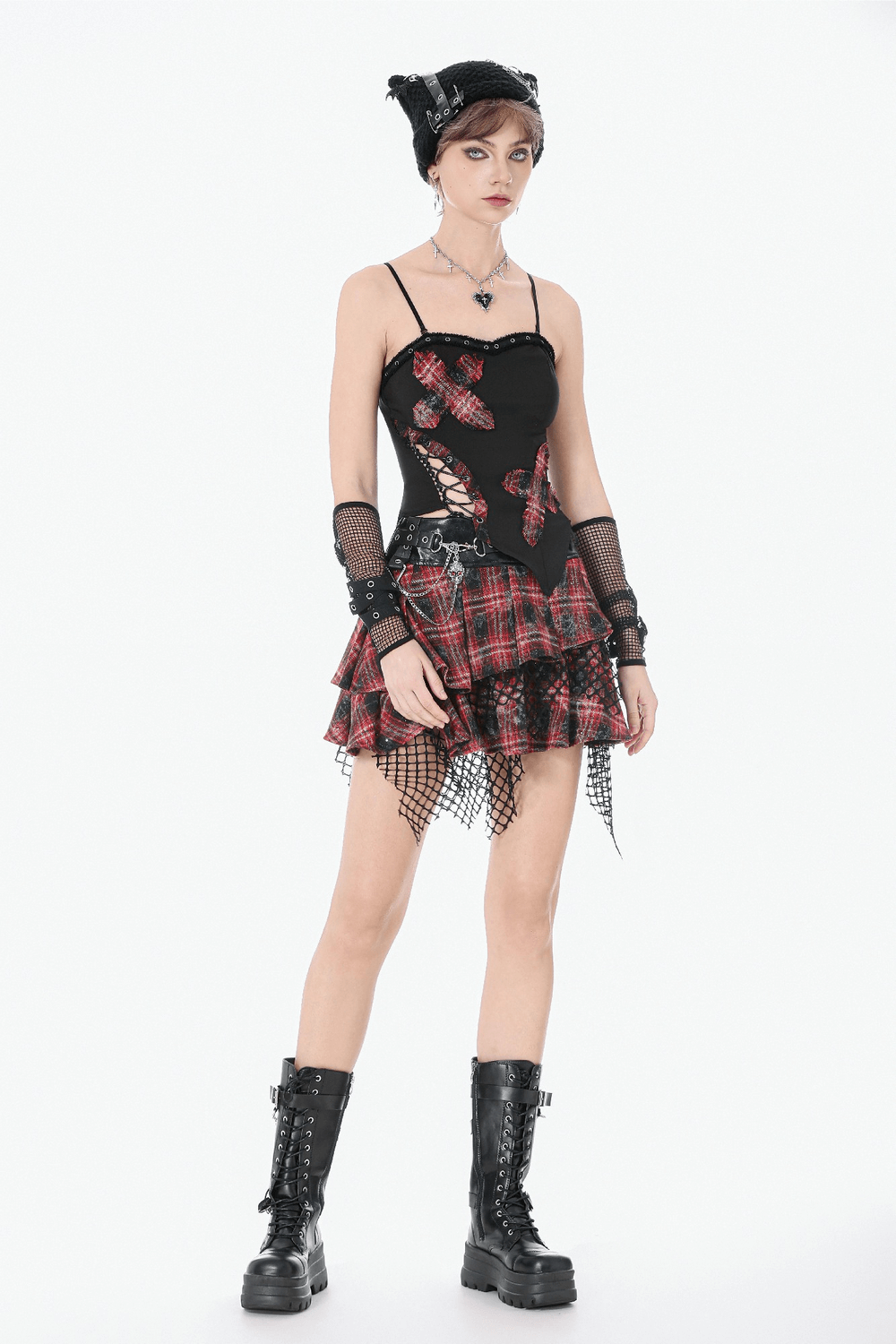 Black Goth Punk Plaid Patch Top with Side Lace Up worn with a plaid skirt and edgy accessories, showcasing a fierce style.