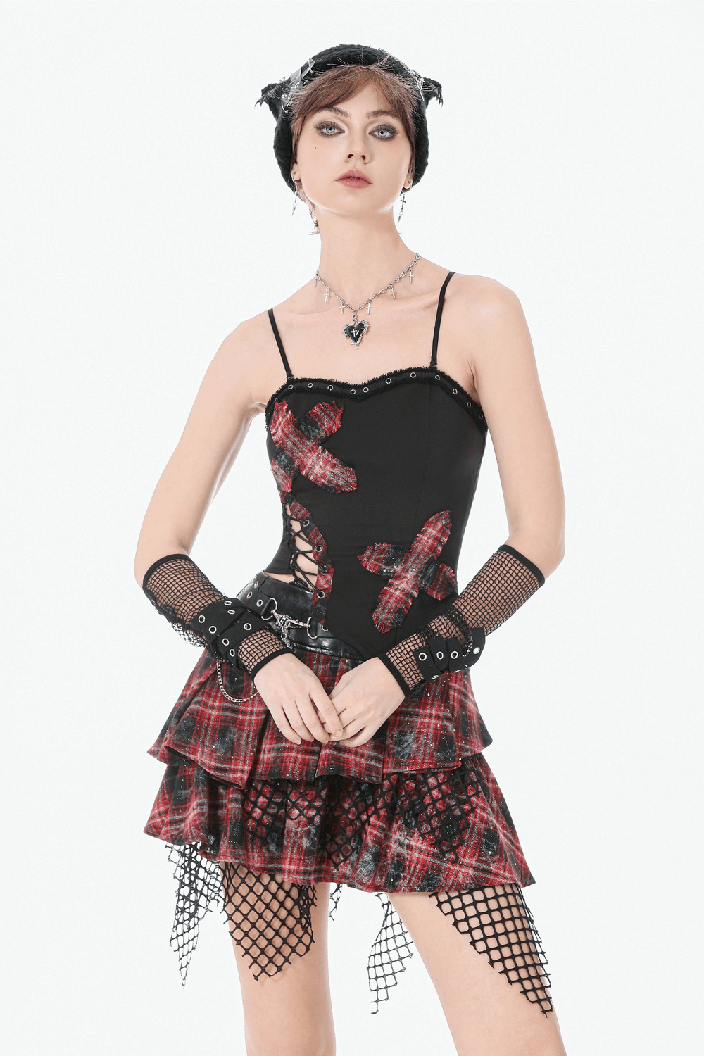 Black Goth Punk Plaid Patch Top with Side Lace Up worn with a layered plaid skirt and fishnet accessories.