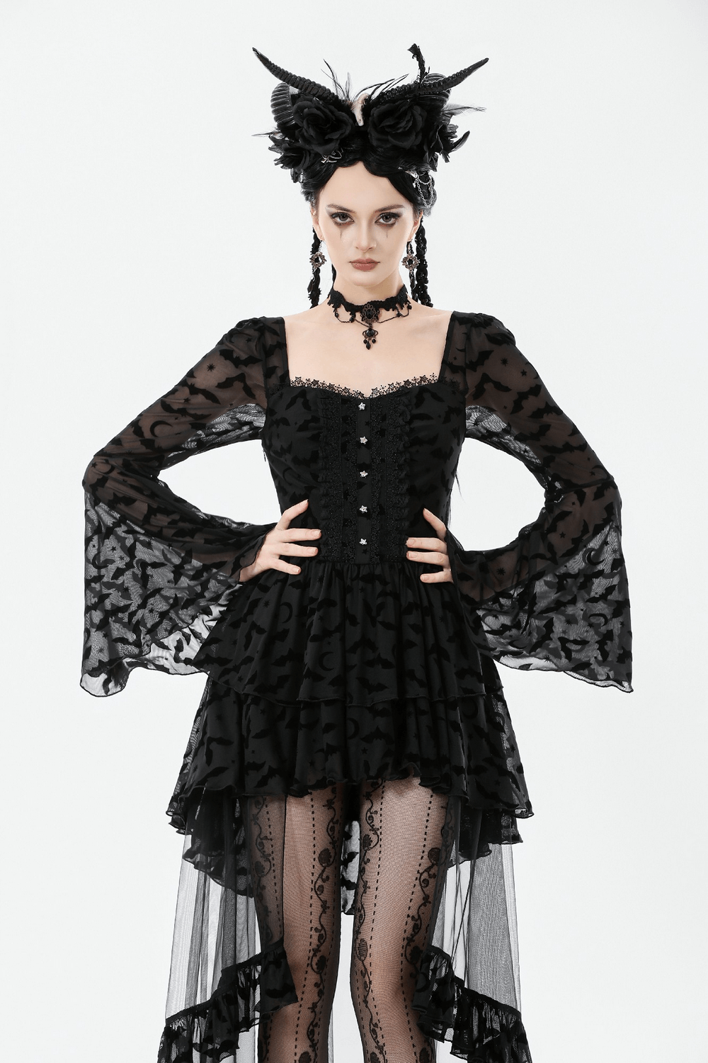 Black Gothic Bat Lace Dress with Sheer High-Low Hem worn with Gothic accessories and dramatic hairstyle.